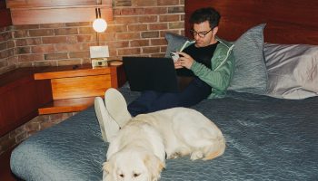 Airbnb CEO Brian Chesky with his Golden Retriever (Sophie) working remotely from Ann Arbor, Michigan
