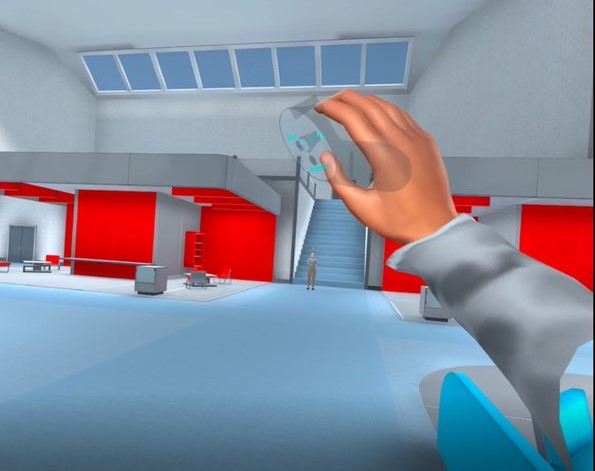 A virtual hand reaches out in a large, open, simulated expo hall.