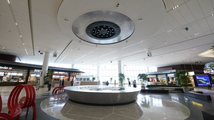 A fountain is seen inside of a food court at LaGuardia Airport