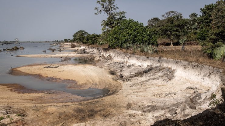 A tract of sand is eaten out of the Gambian coast from mining.