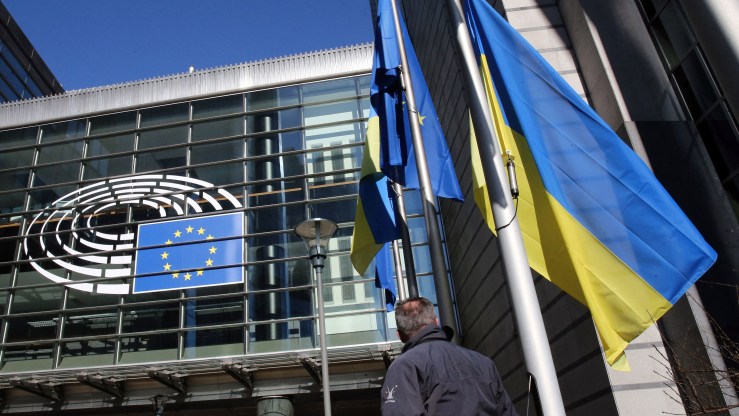 The Ukrainian flag is visible at the European Parliament building in Brussels.