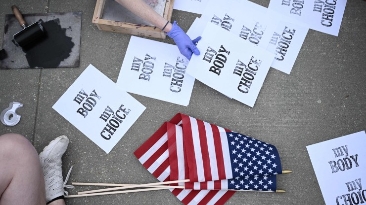 Pro-choice demonstrators make signs in front of the U.S. Supreme Court in Washington, D.C., on Tuesday.