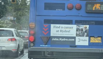 A sign on the back of a bus reads: "Find a career at Hydro!"