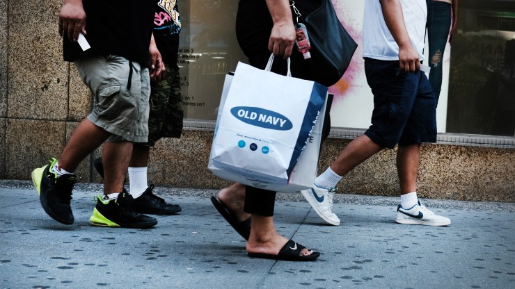 People walk through a shopping district in Brooklyn in 2021 in New York City.