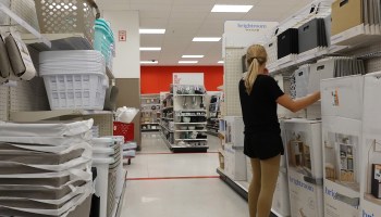 A customer shops in the home goods aisle at Target.