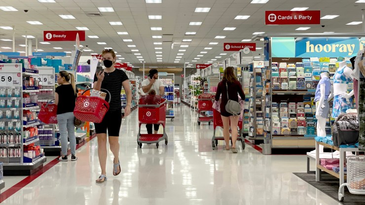 Masked customers shop in a Target store in California.