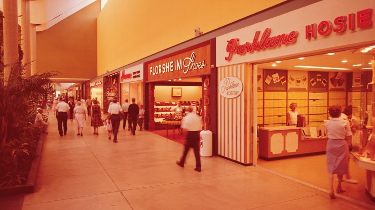Customers walk through a mall in the '60s.