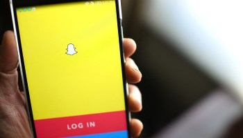 The Snapchat login screen on a smartphone.