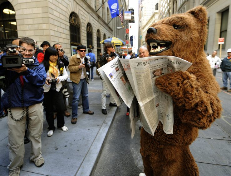 A person dressed as a bear to represent a bear market performs outside the New York Stock Exchange on October 6, 200 in New York. Wall Street tumbled after the opening bell as fallout from the credit crisis triggered concerns about the economy and the Dow fell below 10,000 for the first time in four years. AFP PHOTO / TIMOTHY A. CLARY (Photo credit should read TIMOTHY A. CLARY/AFP via Getty Images)
