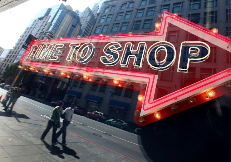 An electronic sign says, "Time to shop."