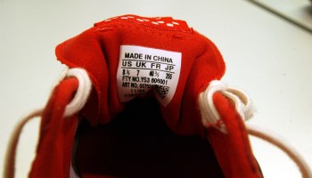 A "Made in China" label displayed on a shoe. Country-of-origin labels have a long history in the U.S., dating all the way back to the 19th century.