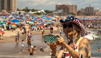 A person takes a selfie at Coney Island beach on July 4, 2021 in New York City. I