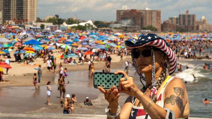A person takes a selfie at Coney Island beach on July 4, 2021 in New York City. I