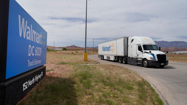 A truck and trailer leaves a Walmart Distribution center on May 19, 2022 in St George, Utah.
