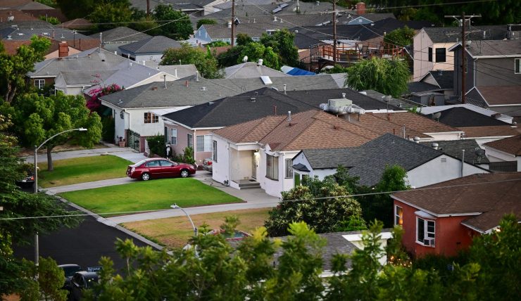 Green grass lawns seen in front of homes in a Los Angeles, Caifornia neighborhood on July 5, 2022. A shortage of housing is making home ownership unaffordable for millions of Americans with prices up more than 30% over the past few years and interest rates rising.