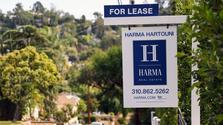 A "For Lease" posted in front of a house available for rent on March 15, 2022 in Los Angeles, California.