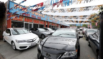 Used cars for sale on an outdoor car lot.
