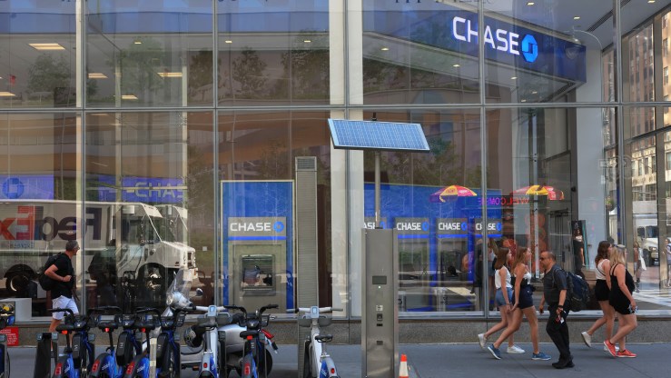 People walk past a New York City Chase Bank.