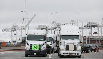Trucks block the entrance to the Port of Oakland.