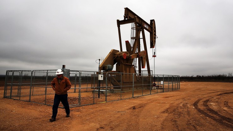 An oil well owned an operated by Apache Corporation in the Permian Basin are viewed on February 5, 2015 in Garden City, Texas.