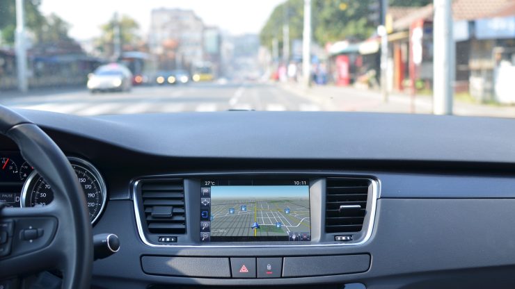 View on a part of a car dashboard with a navigation unit.