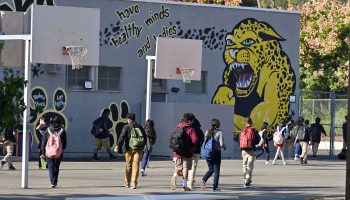 Students walk toward their middle school building in LA.