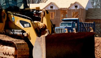 Construction equipment sits in front of a home under construction in Falls Church, Virginia.