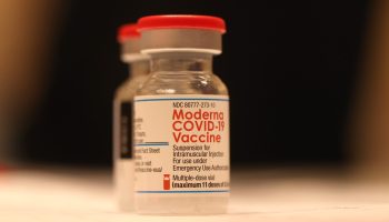 Vials of Moderna COVID-19 vaccine sit on a table at a COVID-19 vaccination clinic in San Rafael, California.