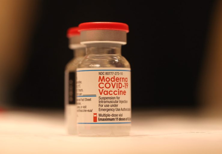 Vials of Moderna COVID-19 vaccine sit on a table at a COVID-19 vaccination clinic in San Rafael, California.