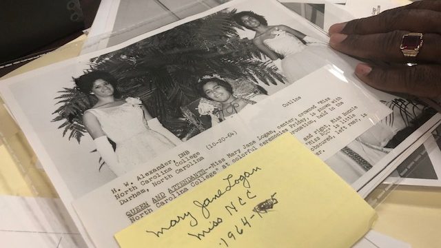 Archivist Andre Vann of North Carolina Central University handles a 1964 photo of the campus homecoming queen and attendants that will be included in the new HBCU Getty Images collection.