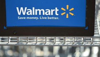 A shopping cart with the Walmart logo is seen outside a Walmart store in Burbank, California on August 15, 2022. - Walmart, the largest retailer the United States, will report second quarter earnings on August 16, 2022. (Photo by Robyn Beck / AFP) (Photo by ROBYN BECK/AFP via Getty Images)