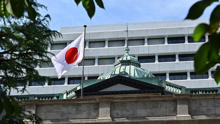 A bank building flying the Japanese flag.