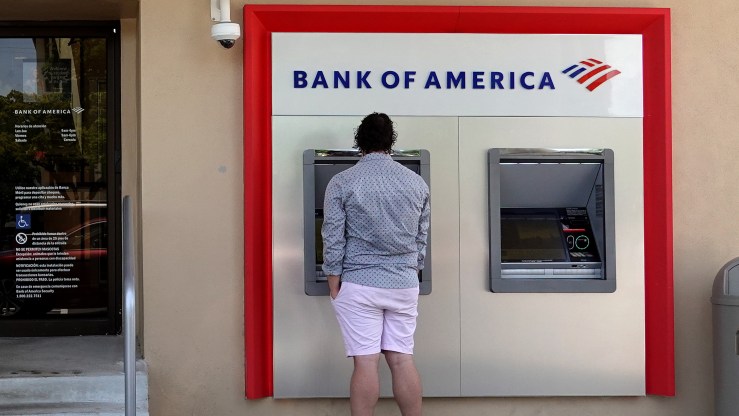 A customer uses a Bank of America ATM machine on July 18, 2022 in Miami, Florida.