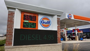 Gasoline prices are displayed at a Gulf gas station.