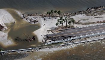 An aerial view of a causeway and bridge that was washed away by Hurricane Ian.