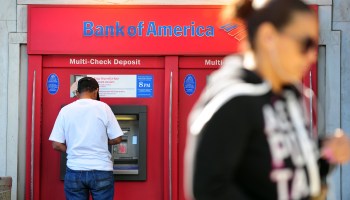 A man withdraws cash from a Bank of America automated teller machine in Hollywood in 2012.