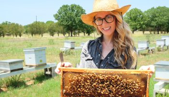 Erika Thompson poses with her bees.
