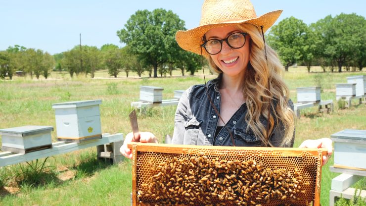 Erika Thompson poses with her bees.