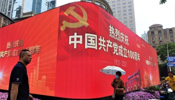A sign celebrating the China's Communist Party's 100th anniversary sat prominently in a commercial center in Shanghai in 2021.