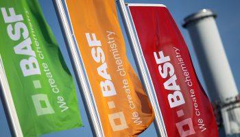 The logo of German chemical giant BASF on flags fluttering in front of the company's headquarters in Ludwigshafen, western Germany, in 2020.