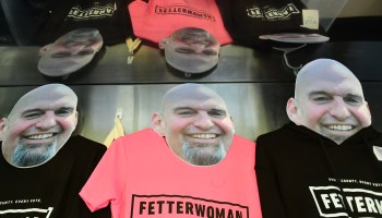 Carboard cutouts of Democratic candidate for U.S. Senate John Fetterman advertise campaign T-shirts for sale at $45.