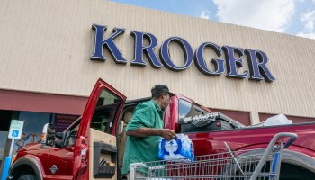 A customer loads his truck after shopping at a Kroger grocery store on Sept. 9 in Houston.