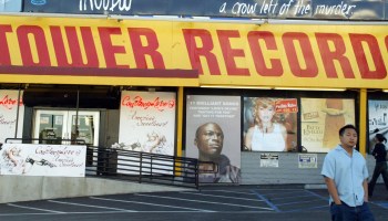 A patron walks through the parking lot of a Tower Records store in Hollywood, California.
