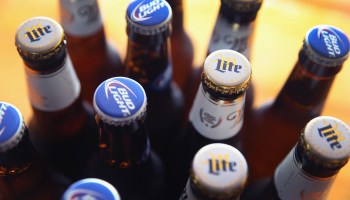 In this photo illustration, bottles of Miller Lite and Bud Light beer that are products of SABMiller and Anheuser-Busch InBev (respectively) are shown on September 15, 2014 in Chicago. Illinois.