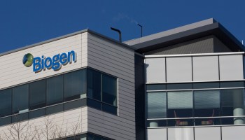A sign for biotechnology company, Biogen, Inc. is seen on a building in Cambridge, Massachusetts, on March 18, 2017.