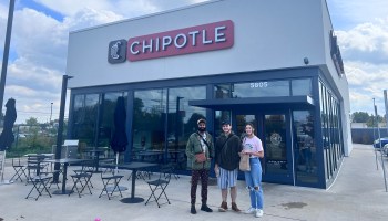 Atulya Dora-Laskey (left), Harper McNamara (middle) and Samantha Smith (right) stand outside of a Chipotle in Lansing, Michigan.
