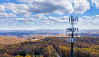 Aerial view of cellular tower over forested section of West Virginia