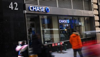 People walk past a Chase Bank