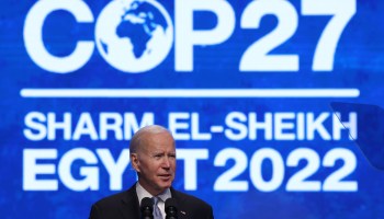 President Joe Biden speaks in front of a banner reading "COP27 - Sharm El-Shiekh - Egypt 2022"