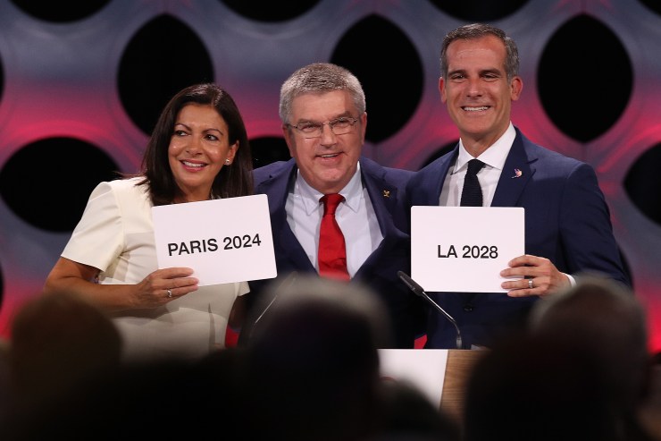 Paris Mayor Anne Hidalgo, IOC President Thomas Bach and Los Angeles Mayor Eric Garcetti are pictured in 2017, when Paris was confirmed as Olympic host in 2024 and Los Angeles in 2028.
